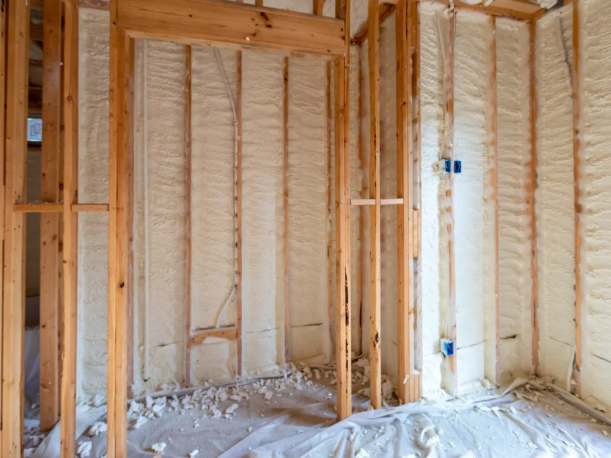 Close view of spray foam removal work in progress