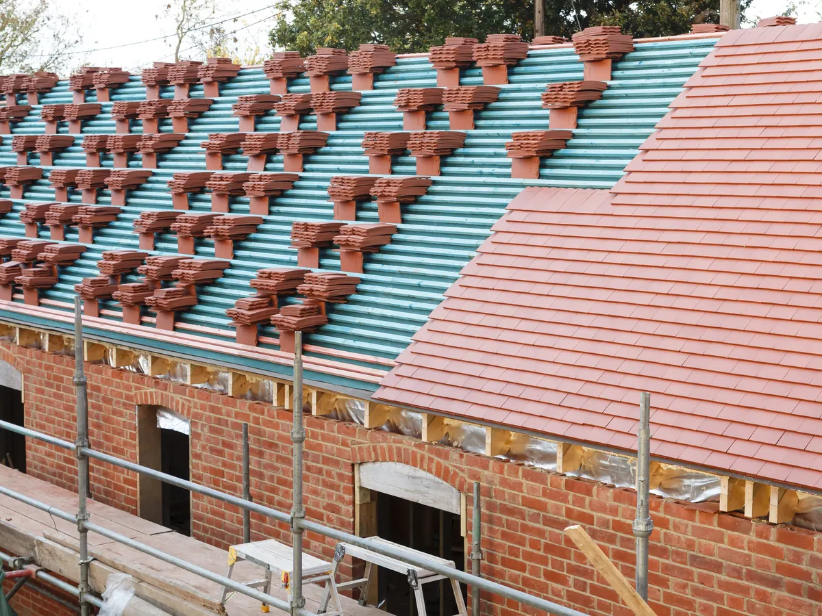 Close view of tile roofs work in progress